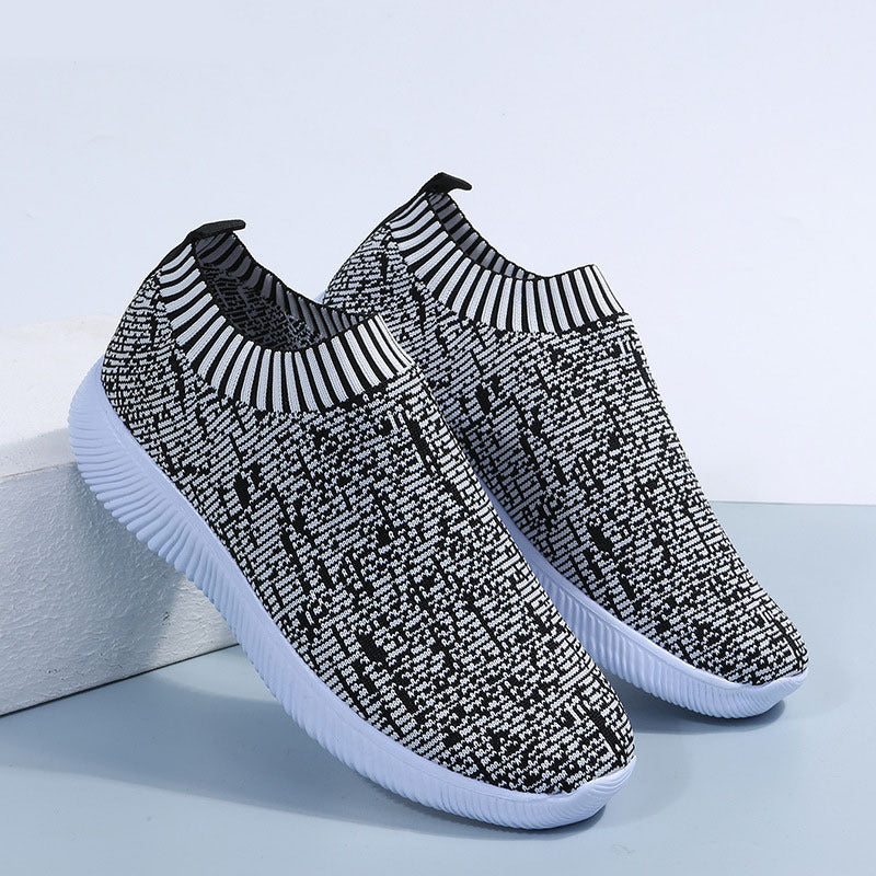 Baskets plates en chaussettes tricotées Stripe, idéales pour courir et marcher.